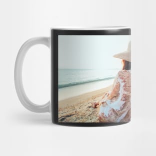 Beautiful Elegant Woman Sitting on Beach and Watching the Ocean Mug